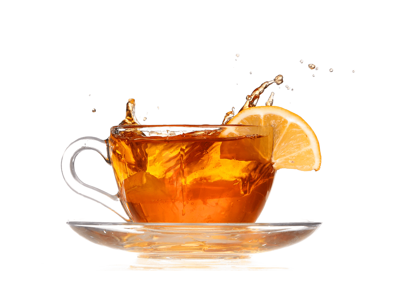 tea splashing out of a glass cup with a slice of orange on this side of the glass