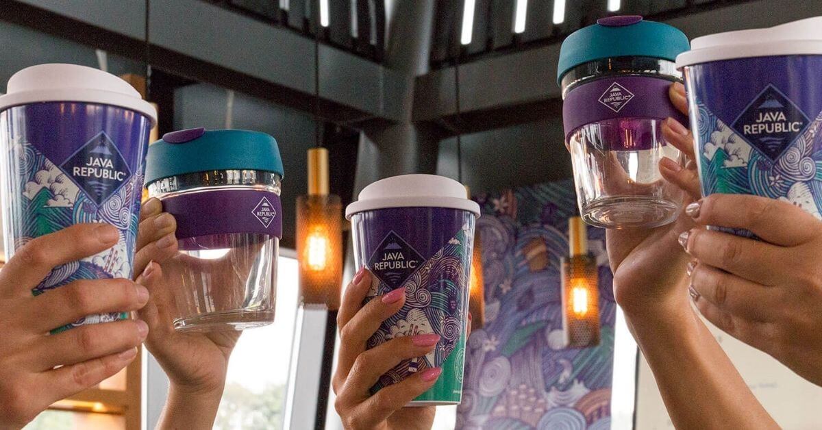 Reusable Java Republic cups being held in the air