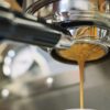 Espresso pulling from coffee machine