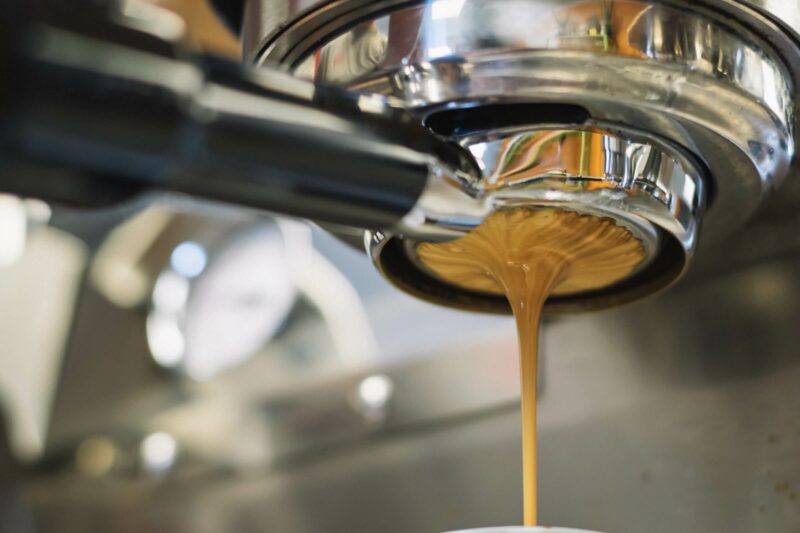 Espresso pulling from coffee machine