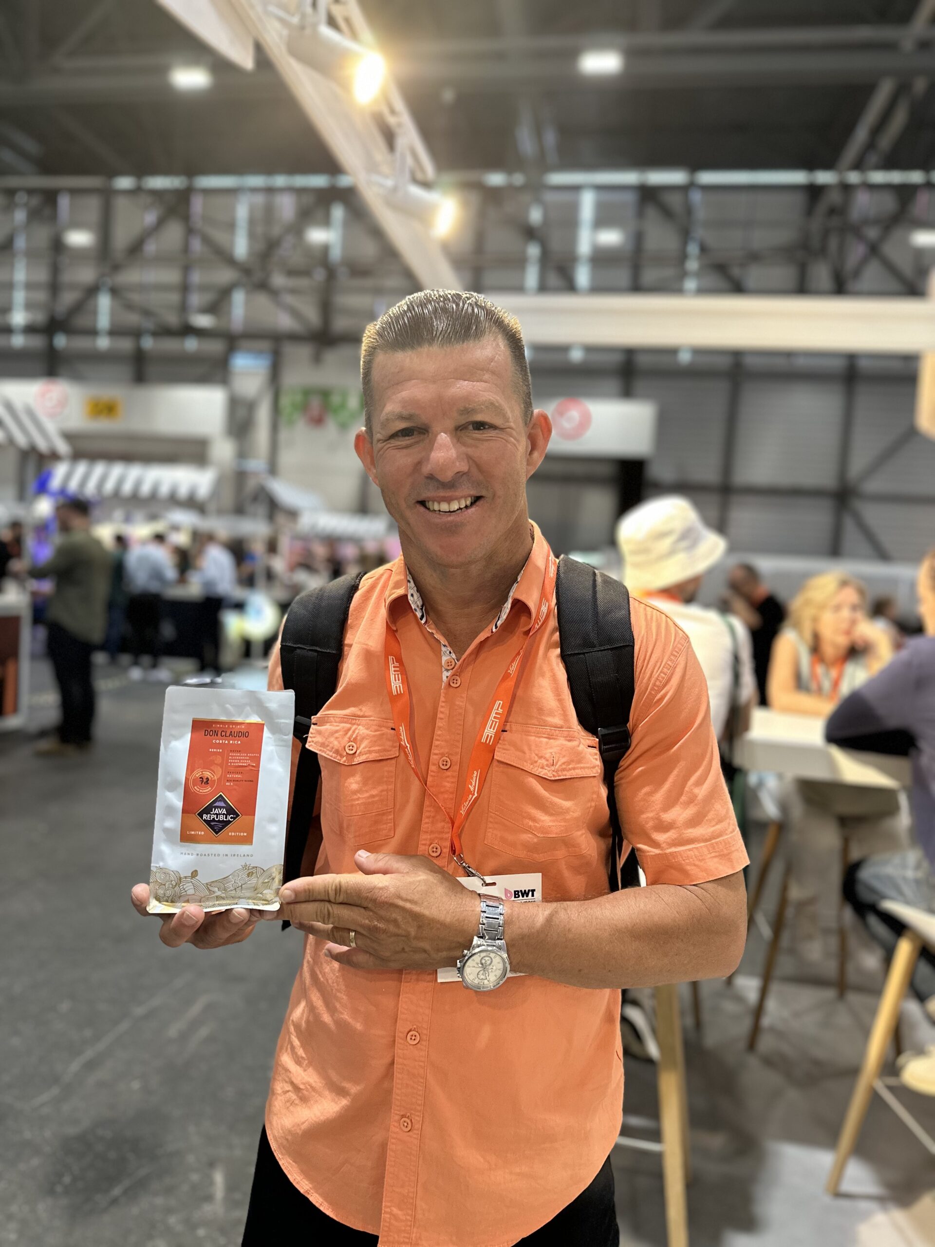 One of the producers of our limited edition Don Claudio coffee holding a bag of coffee