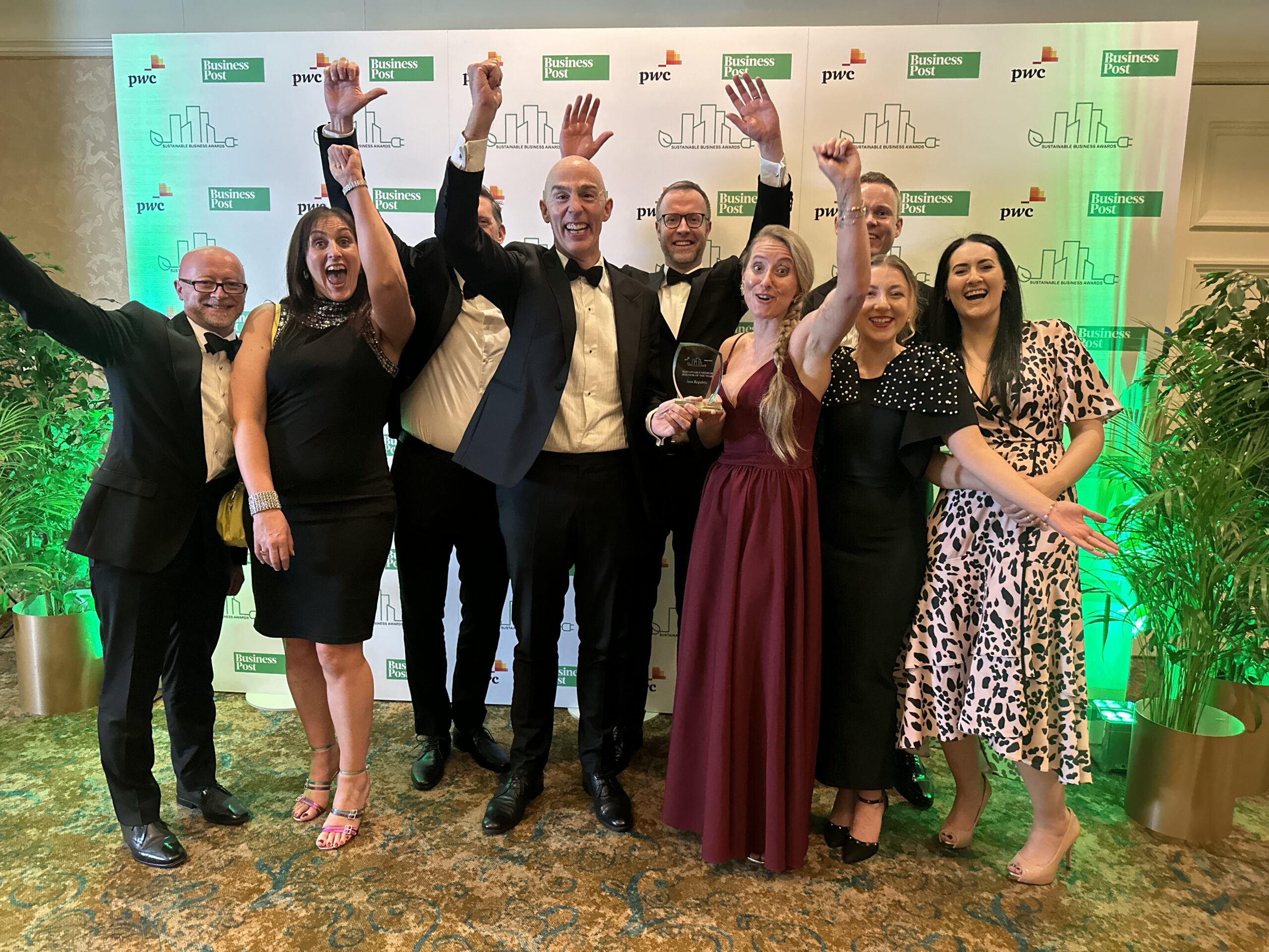 Group shot of Java Republic staff celebrating PwC sustainable medium business of the year award
